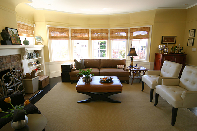 Contemporary living room, bright color accent, modern interior design, Bright light, fireplace built in surround, 